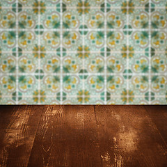 Image showing Wood table top and blur vintage ceramic tile pattern wall