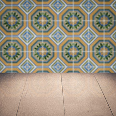 Image showing Wood table top and blur vintage ceramic tile pattern wall