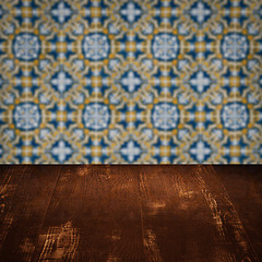 Image showing Wood table top and blur vintage ceramic tile pattern wall