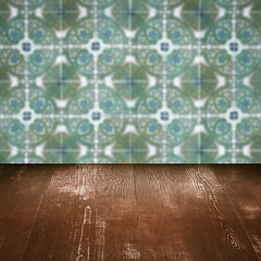 Image showing Wood table top and blur vintage ceramic tile pattern wall