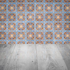 Image showing Wood table top and blur vintage ceramic tile pattern wall