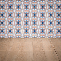 Image showing Wood table top and blur vintage ceramic tile pattern wall