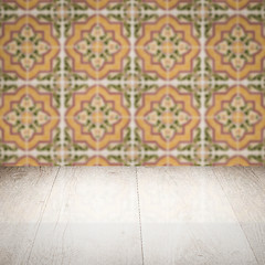 Image showing Wood table top and blur vintage ceramic tile pattern wall