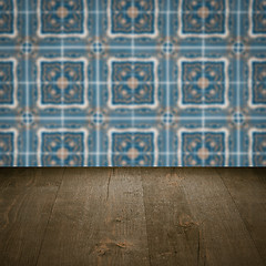 Image showing Wood table top and blur vintage ceramic tile pattern wall