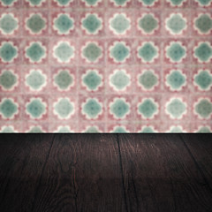 Image showing Wood table top and blur vintage ceramic tile pattern wall