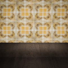 Image showing Wood table top and blur vintage ceramic tile pattern wall