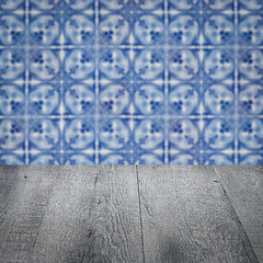 Image showing Wood table top and blur vintage ceramic tile pattern wall