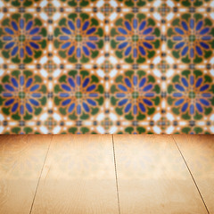 Image showing Wood table top and blur vintage ceramic tile pattern wall