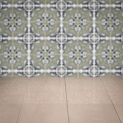 Image showing Wood table top and blur vintage ceramic tile pattern wall