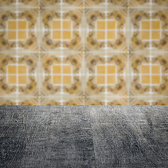 Image showing Wood table top and blur vintage ceramic tile pattern wall