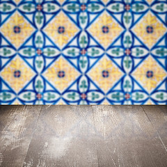 Image showing Wood table top and blur vintage ceramic tile pattern wall