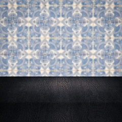 Image showing Wood table top and blur vintage ceramic tile pattern wall