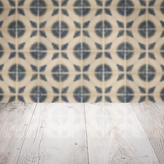 Image showing Wood table top and blur vintage ceramic tile pattern wall