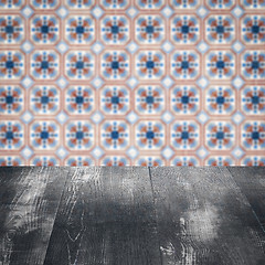 Image showing Wood table top and blur vintage ceramic tile pattern wall