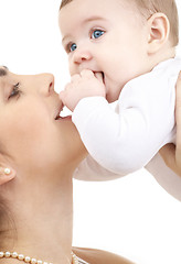 Image showing happy mother playing with baby boy