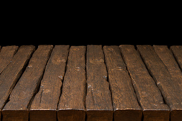 Image showing Wooden top and dark space 