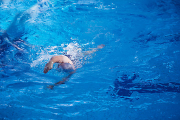 Image showing swimmer excercise on indoor swimming poo