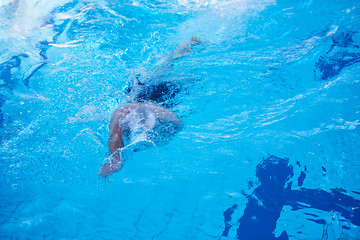 Image showing swimmer excercise on indoor swimming poo