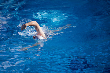 Image showing swimmer excercise on indoor swimming poo