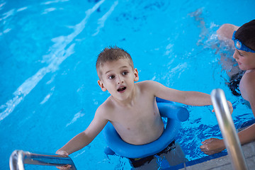 Image showing child on swimming poo