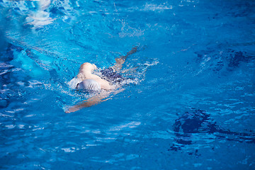 Image showing swimmer excercise on indoor swimming poo