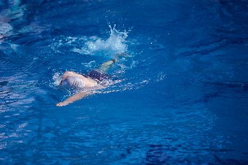 Image showing swimmer excercise on indoor swimming poo