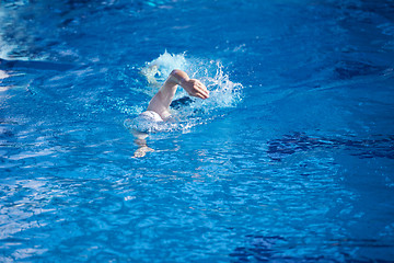 Image showing swimmer excercise on indoor swimming poo