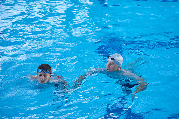 Image showing child group  at swimming pool school class