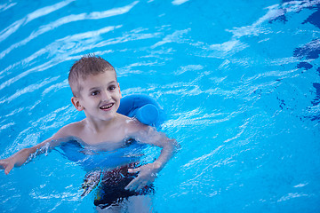 Image showing child on swimming poo