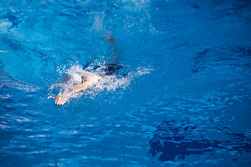 Image showing swimmer excercise on indoor swimming poo