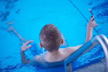 Image showing child on swimming poo