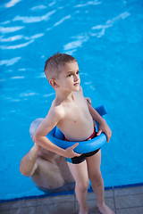 Image showing child on swimming poo