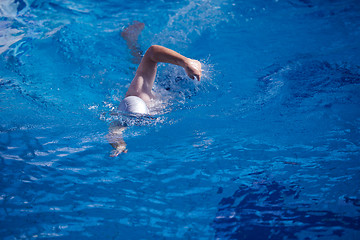 Image showing swimmer excercise on indoor swimming poo