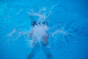 Image showing swimmer excercise on indoor swimming poo