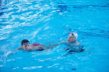 Image showing child group  at swimming pool school class