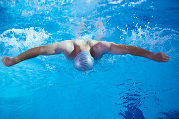 Image showing swimmer excercise on indoor swimming poo