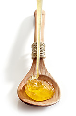 Image showing honey pouring into spoon