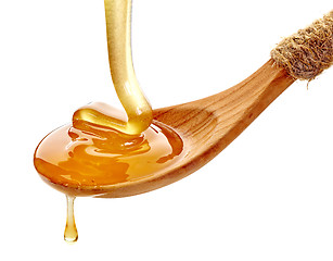 Image showing wooden spoon with honey