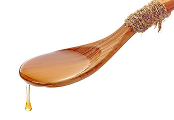 Image showing wooden spoon with honey