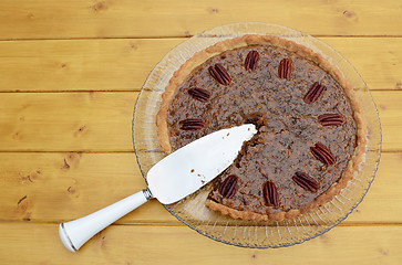 Image showing Pie server in a sliced pecan pie