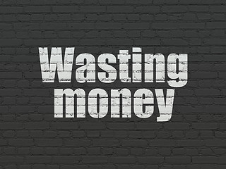 Image showing Banking concept: Wasting Money on wall background