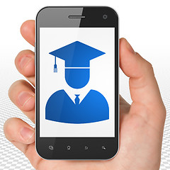 Image showing Science concept: Hand Holding Smartphone with Student on display