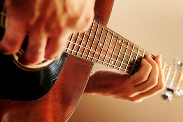 Image showing Man playing a guitar