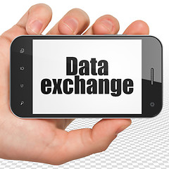 Image showing Information concept: Hand Holding Smartphone with Data Exchange on display