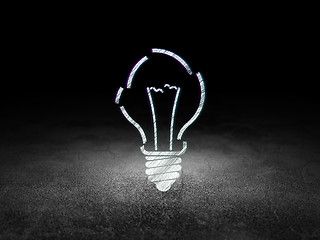 Image showing Finance concept: Light Bulb in grunge dark room