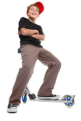 Image showing Boy sitting handlebars scooter