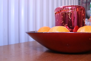 Image showing festive candle and clementines