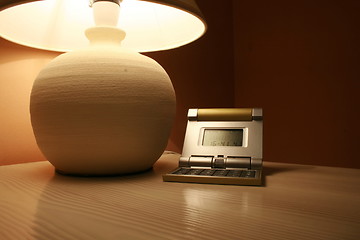 Image showing table lamp and a travel clock