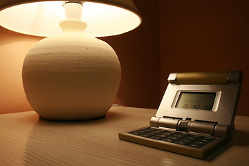 Image showing table lamp and a travel clock