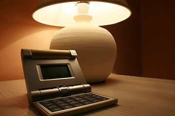 Image showing table lamp and a travel clock